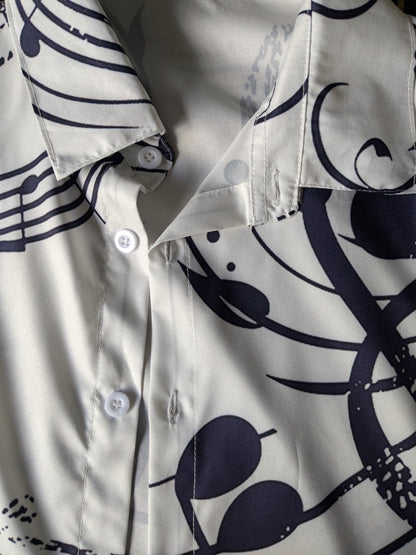 Camicia in poliestere. Note musicali blu bianco stampa. Taglia M.