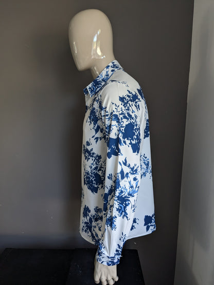 Camisa de poliéster. Estampado blanco azul. Talla L.