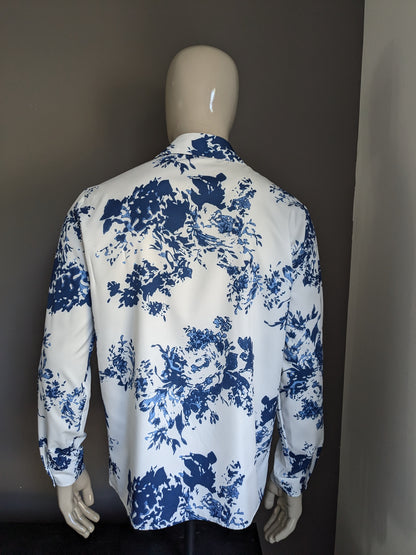 Polyester overhemd. Blauw witte print. Maat L.