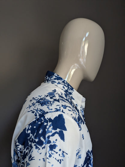 Polyester overhemd. Blauw witte print. Maat L.