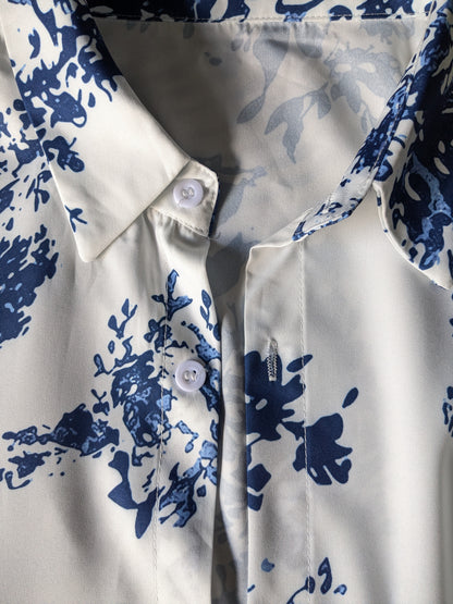 Polyester shirt. Blue white print. Size L.