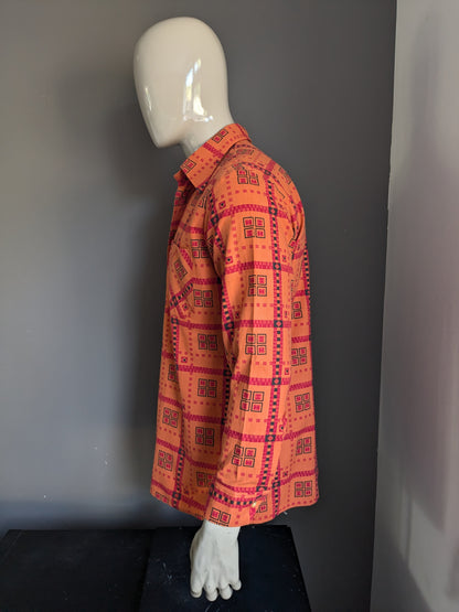 Chemise vintage des années 70 avec collier ponctuel. Impression noire rouge orange. Taille L.