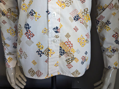 Shirt de Michel des années 70 vintage avec collier. Imprimé bleu brun jaune beige. Taille M.