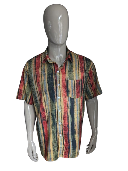 Camisa de Misslook manga corta. Estampado negro rojo rojo amarillo. Tamaño xxl.