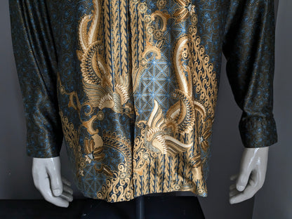 Queen Busana Batik overhemd. Licht gevoerd. Blauw zwart goudkleurige print. Maat XL.