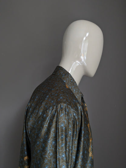 Camicia da regina busana batik. Leggermente foderato. Stampa blu nera oro -colore. Taglia XL.