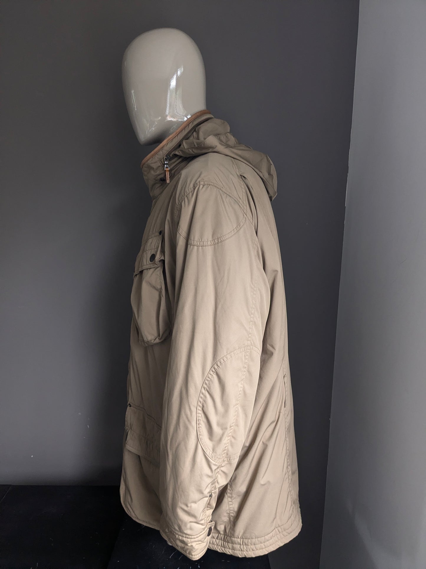 Polo Ralph Lauren Winter jacket. Beige colored. Double closure and hidden hood. Size 3XLB BIG.