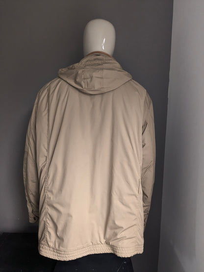 Polo Ralph Lauren Winter jacket. Beige colored. Double closure and hidden hood. Size 3XLB BIG.