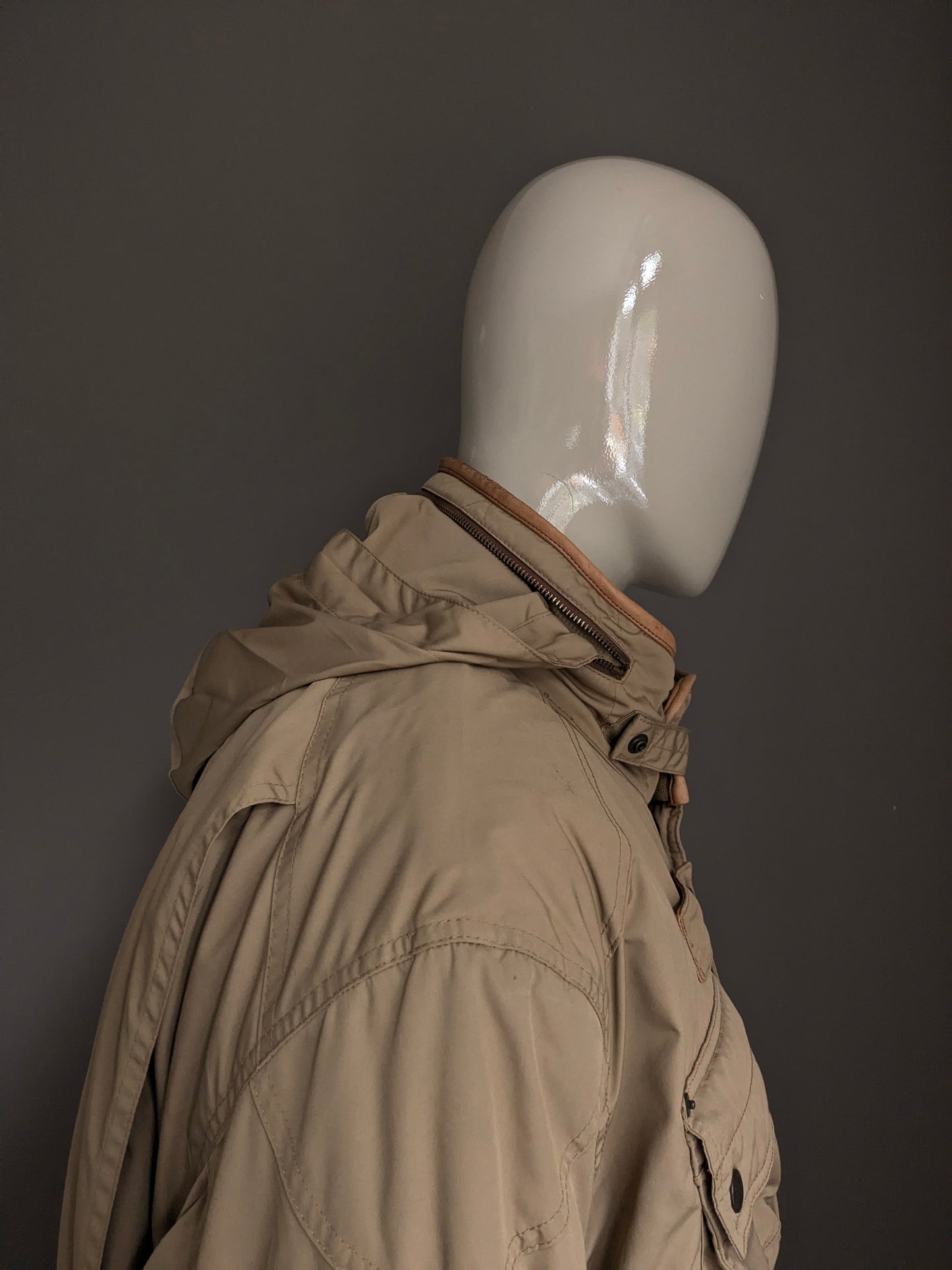 Polo Ralph Lauren Winter jacket. Beige colored. Double closure and hidden hood. Size 3XLB BIG.