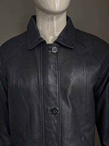 Donna D leather jacket with zip and button closure. Black colored. Size L.