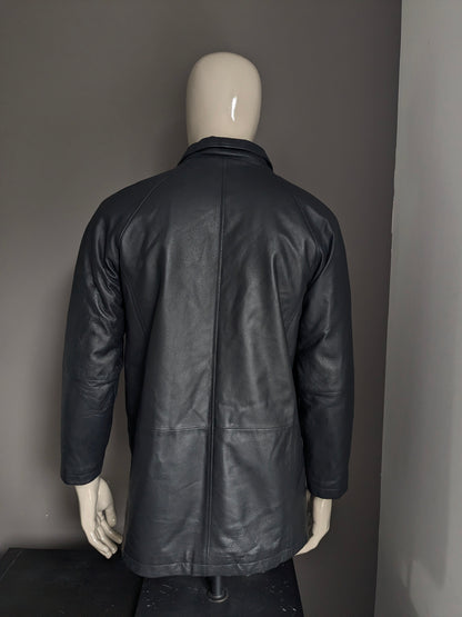 Donna D leather jacket with zip and button closure. Black colored. Size L.