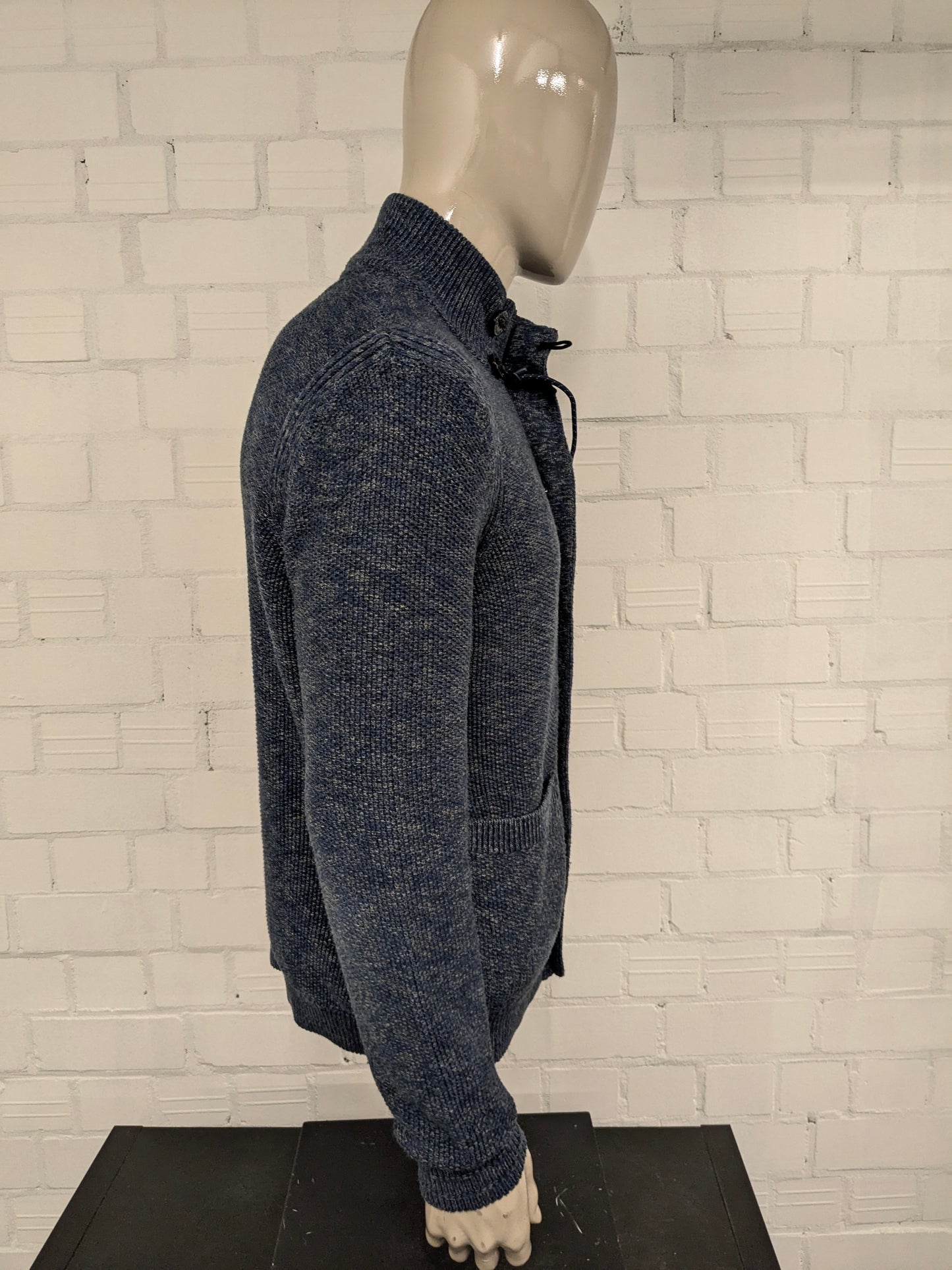 Cardigan Lerros avec fermeture éclair et boutons. Vert bleu mélangé. Taille M.