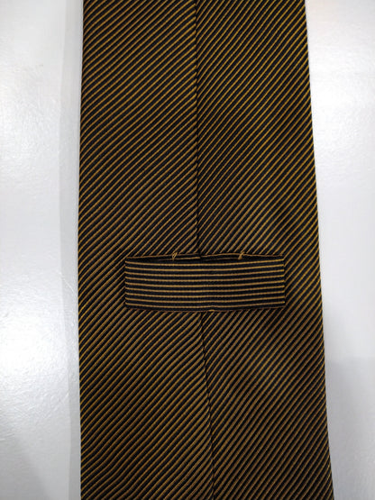 Silk tie. Yellow gold black motif.