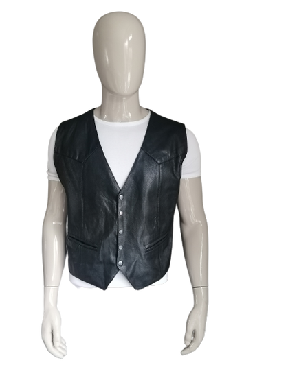 Goat leather pours with press studs and leather back. Black colored. Size L.