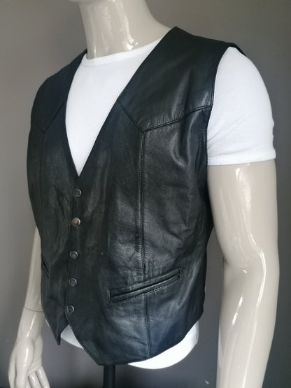 Goat leather pours with press studs and leather back. Black colored. Size L.